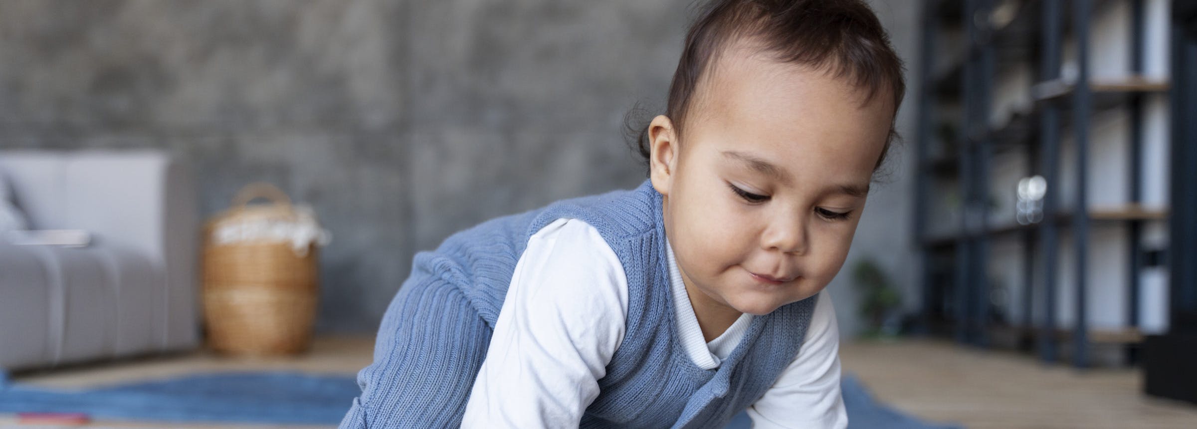 baby-crawling-floor-playing-with-toy